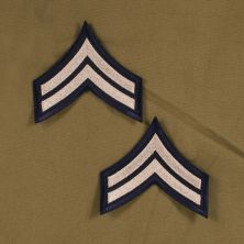 US Army WW2 Corporal Rank Stripes Khaki on Blue.
