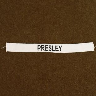 Presley name tape. Black on white.
