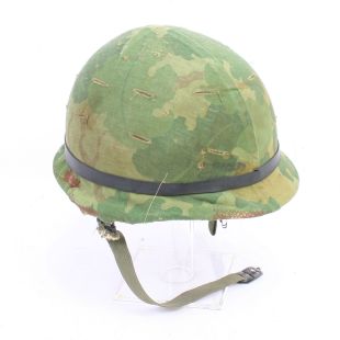Original Vietnam helmet with camouflage cover and liner 1965