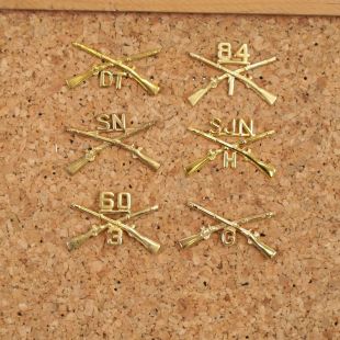 Pack of US Army Branch of Service badges with unit numbers